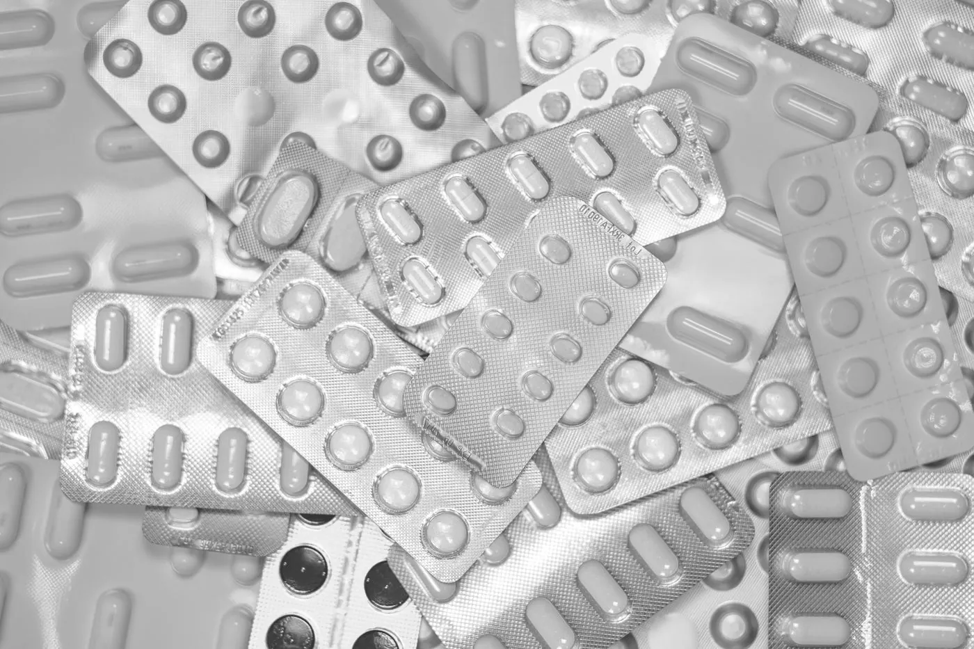 Close-up of assorted blister packs in black and white.